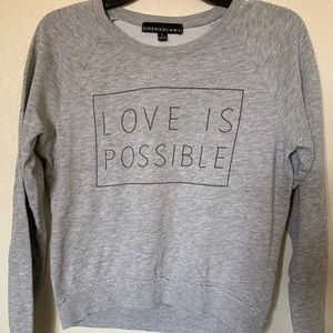Love is possible sweater